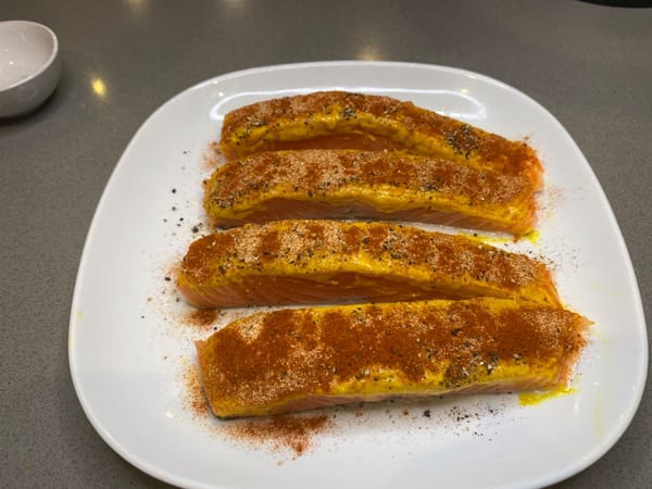 Generously coat with garlic powder and paprika.