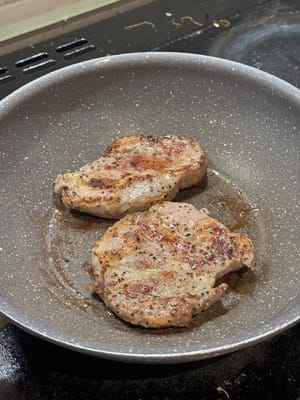 In a lightly oiled pan, sear the pork shoulder until slightly charred