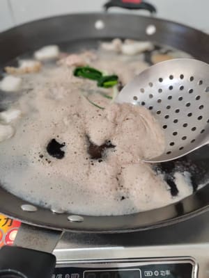 打去表面的浮沫