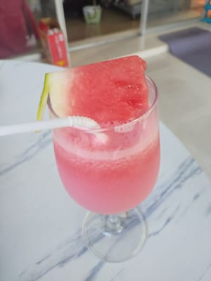 Garnish the rim of the cup with watermelon slices.