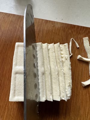 Cut the tofu into jagged shapes with a knife