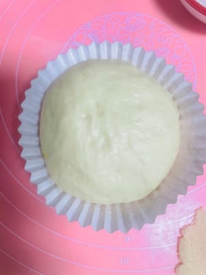 Stuffing and shaping: Take the dough and wrap the pineapple filling like making dumplings, with the seam facing down, and shape into small round balls.
