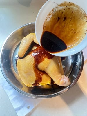 Pour and rub the sauces over the chicken. If you can, use toothpick/knife to poke holes on the chicken so that it can be marinated more thoroughly
