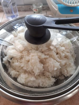 Cuire à nouveau à la vapeur jusqu'à ce que le tout soit cuit, environ 20 minutes.