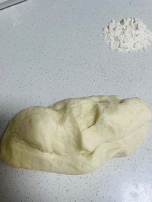 Smooth the dough, cover with plastic wrap and let it ferment until it doubles in size, then wait for it to