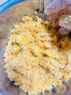 Add 40g of butter melted at room temperature and mix well. This will make the meat floss sticky and can be rolled into a ball.