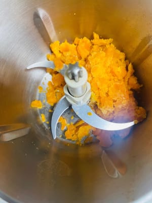 Let the egg yolks cool slightly, crush them with your hands, and then blend them in a blender until they are even finer.