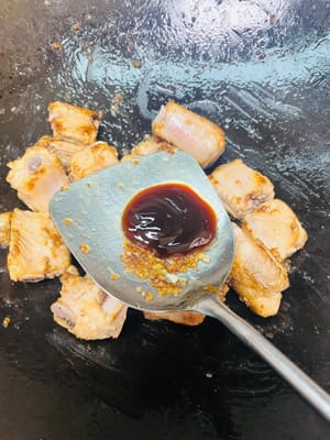 Pour cooking wine along the side of the pot for flavor. Add one tablespoon of oyster sauce and one tablespoon of dark soy sauce for flavor and color. (No need to add extra salt since the preserved plums are salty.)