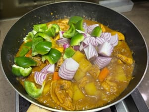 Add onions and green peppers