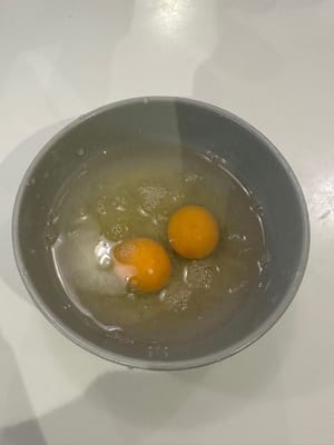 While the patty is steaming. Prepare the egg mixture by adding warm water to the eggs in 1:1.5 ratio. For example, the two eggs used in this recipe weight 110g so 165g warm water is added.
