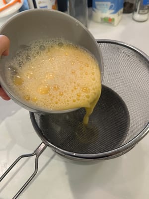For better egg texture, sieve the egg mixture once