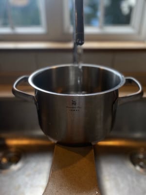 Pour Water into the Saucepan