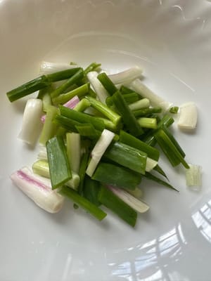 three scallions and three cloves of garlic.