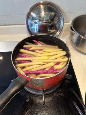 Once drained, bring a pot of water to a boil. Add salt and a bit of vinegar, as well as the potatoes
