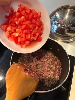 Add in diced tomatoes, as well as salt and pepper to taste