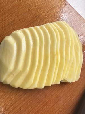 Cut the potatoes into thin strips and add a little salt.