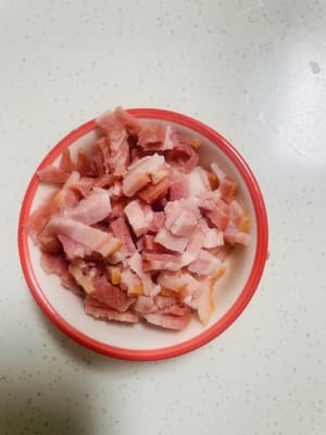 Chop bacon into small pieces.