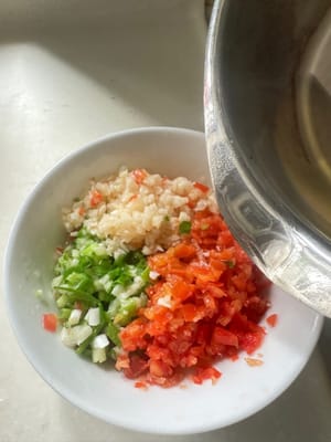 add garlic, red pepper, onion, and hot oil. Mix well and set aside. You can choose to add chili if you like.