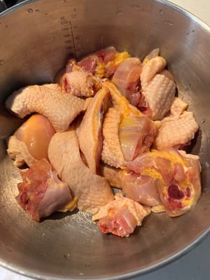Firstly, chop the chicken legs into chunks