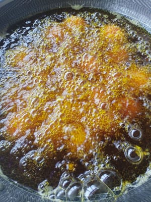 Fry the dumplings in a pan for 10 minutes until golden brown.