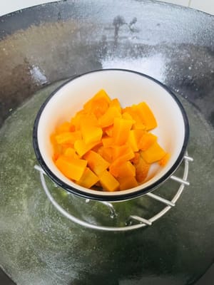 Peel and cut the pumpkin into pieces, steam until cooked and set aside.