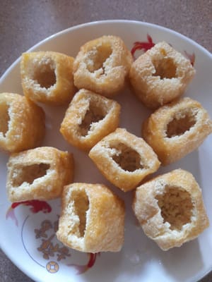 Tahu pong, make a hole in one side (discard the inside)