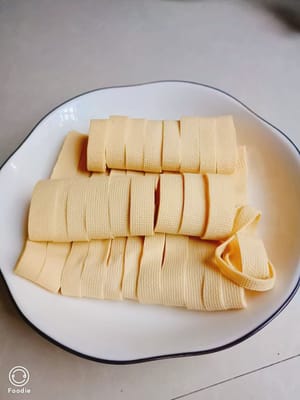 Cut the bean curd into strips.