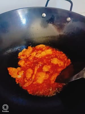 stir-fry until the oil turns red.