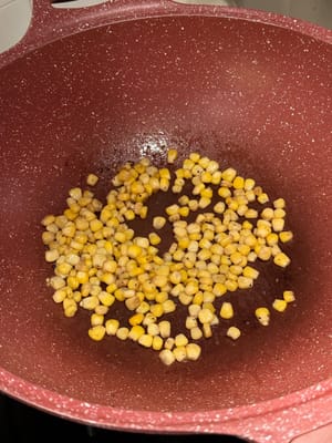 In the same pan, add a scoop of butter, and fry the corns slightly. Reserve