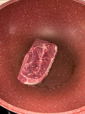 Firstly, cook the steak to your own preference. Spread the truffle sauce onto the steak for seasoning