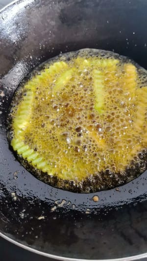 Add potato strips and lettuce strips, gently stir and fry until cooked through. Remove and set aside.