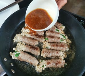 then add the seasoning sauce (soy sauce, oyster sauce, sugar, ginger, garlic, pepper, tapioca flour and sesame oil)