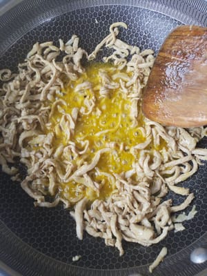 Stir-fry until dry and place on a plate for later use.