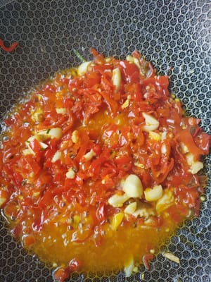 Stir-fry sour peppers with ginger and garlic.