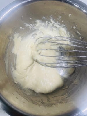 Add flour to the batter. Pour in the cake flour and mix using a