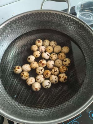 Bring water to a boil. Pour the quail eggs into the pot and cook for 5 to 7 minutes. Remove and set aside.