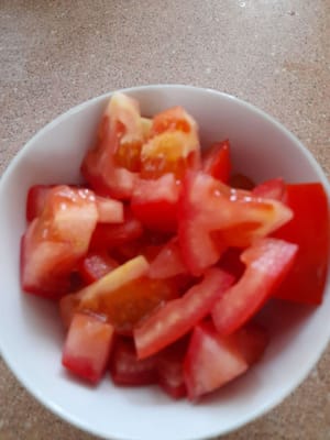 Shallots and garlic, chilies and tomatoes, sliced spring onions