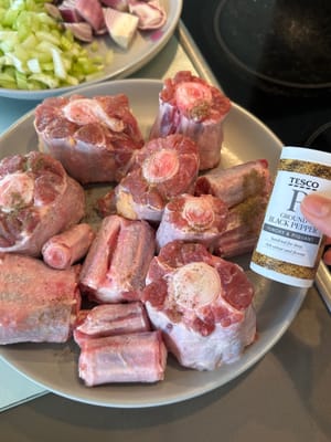 Firstly, season the oxtail with salt and pepper, rub thoroughly onto all sides
