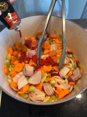 Then add in the tomato paste and continue to stir fry