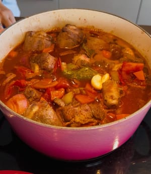 Add in the bay leaves and garlic