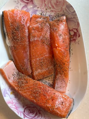 Start by marinating the salmon with salt and pepper for 10 minutes