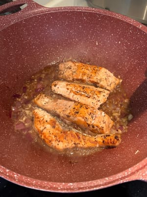 Add salmon back to the pan and thicken the sauce