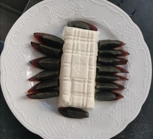then arrange the black eggs (place them on the edge of the tofu)