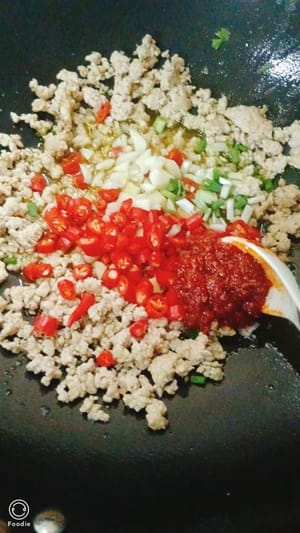 Add another spoonful of bean paste.