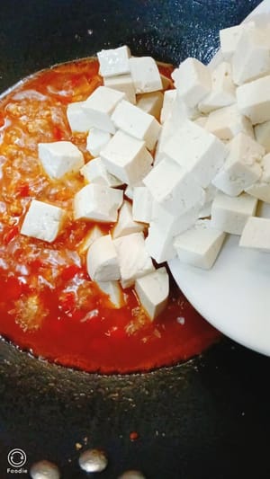 Pour in the prepared tofu and stir-fry for a few times.