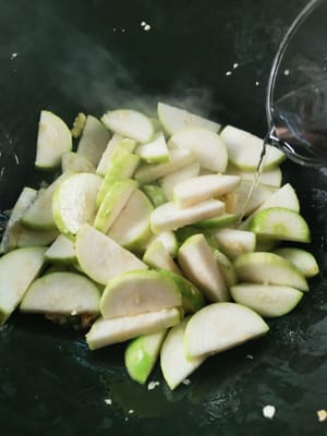 stir until slightly wilted, then add water