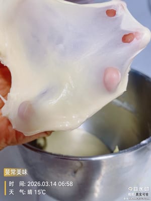 Now add the butter and continue kneading until it forms a thin, elastic membrane (like a glove). The membrane should be thin and resilient, with smooth edges when torn.