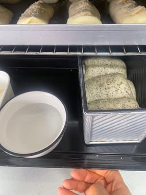 Place the loaf pan in a humid environment at around 30°C and let it rise until it is 80% full (about the height of the edge of the loaf pan). Then you can prepare to bake it.