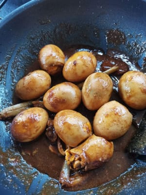 then open the lid and add 1/2 teaspoon of dark soy sauce, then stir well