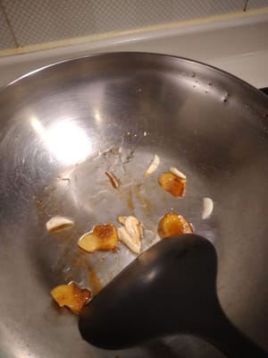 In a pan, add a tbsp of cooking oil and saute garlic and ginger till you smell the aroma then add the chicken feet.